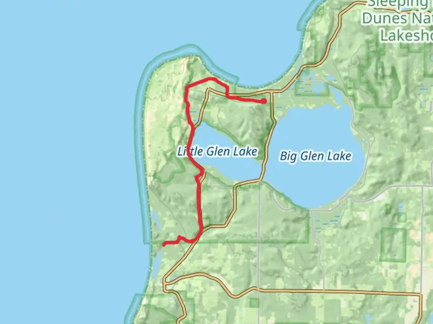 An image depicting the trail Sleeping Bear Heritage Trail and its surrounding area.