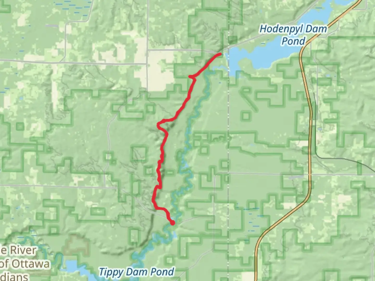 An image depicting the trail Hodenpyl Dam Pond via North Country National Scenic Trail and its surrounding area.