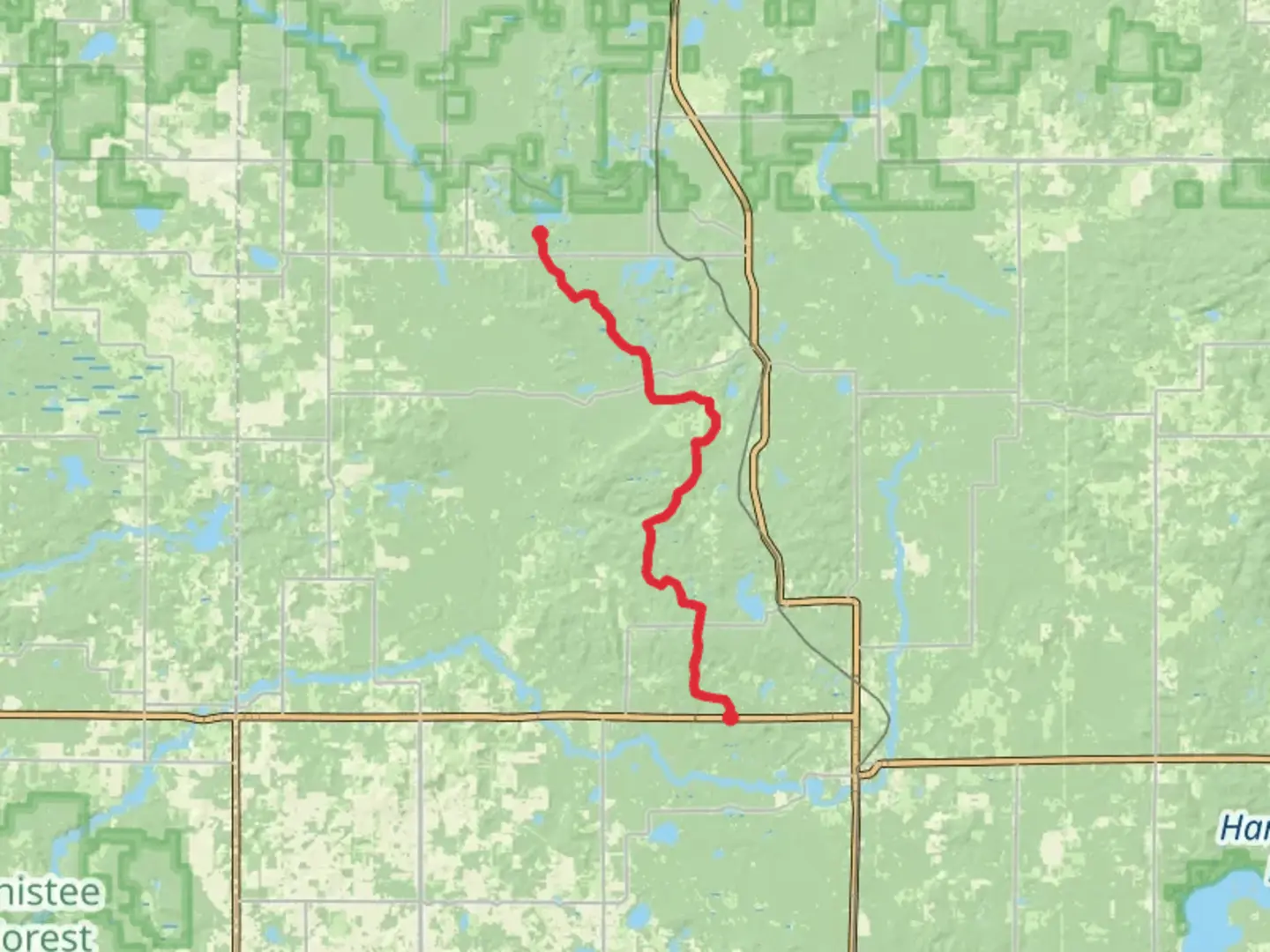 An image depicting the trail Nichols Lake via North Country National Scenic Trail and its surrounding area.