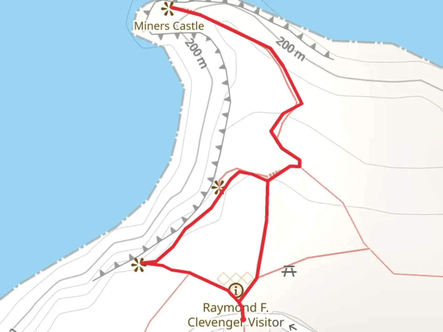 An image depicting the trail Miners Castle Point and its surrounding area.