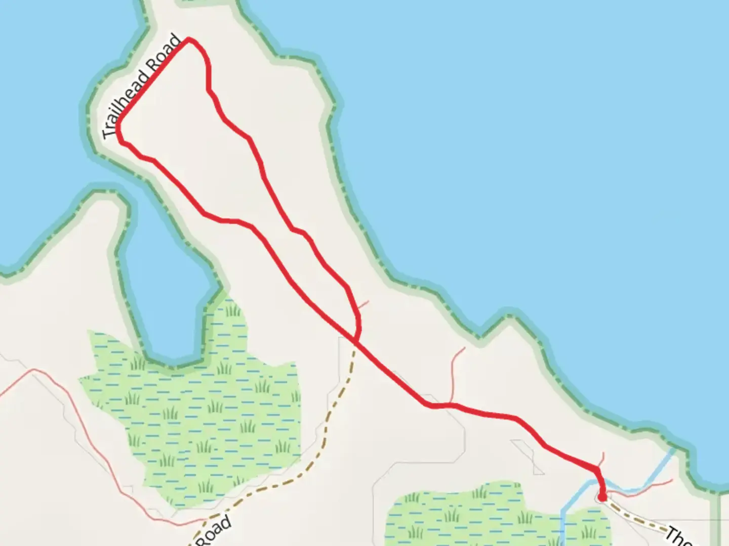 An image depicting the trail Thompson Harbor State Park and its surrounding area.