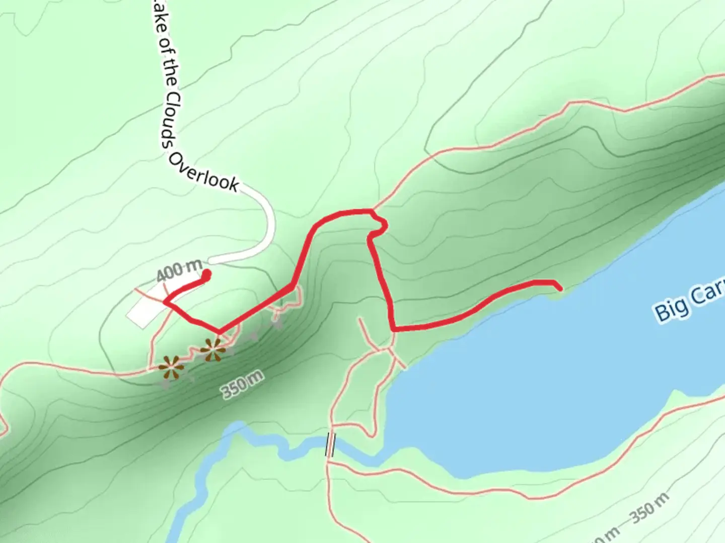 An image depicting the trail Lake of the Clouds - Escarpment Trail and its surrounding area.