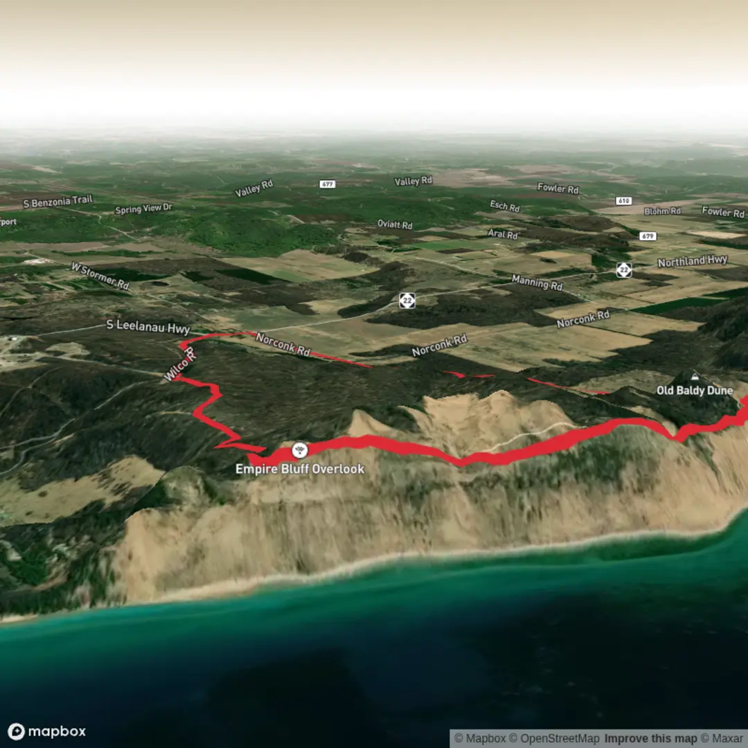 An image depicting the trail Sleeping Bear Dunes National Lakeshore and its surrounding area.