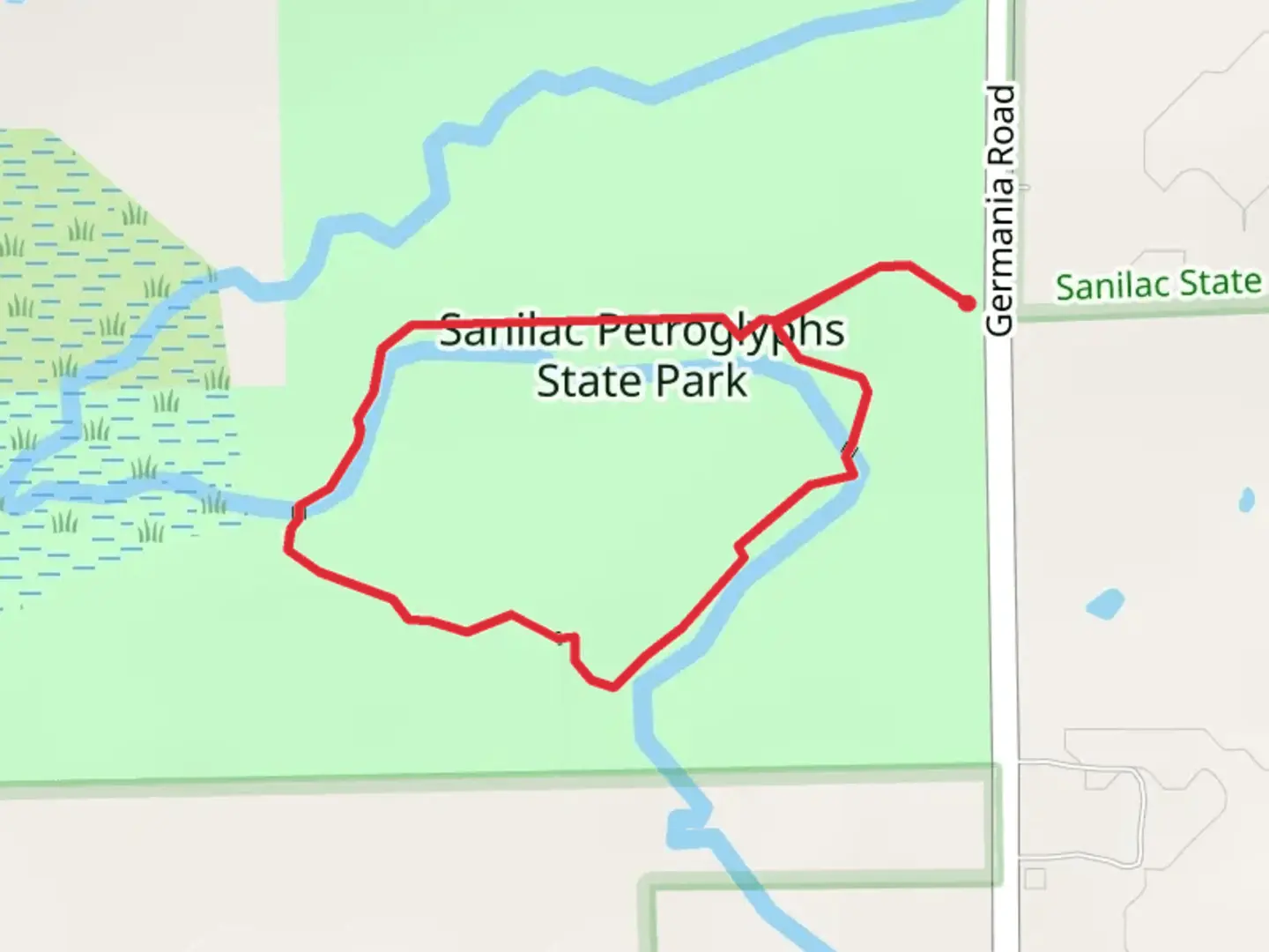 An image depicting the trail Sanilac Petroglyphs State Park Loop and its surrounding area.