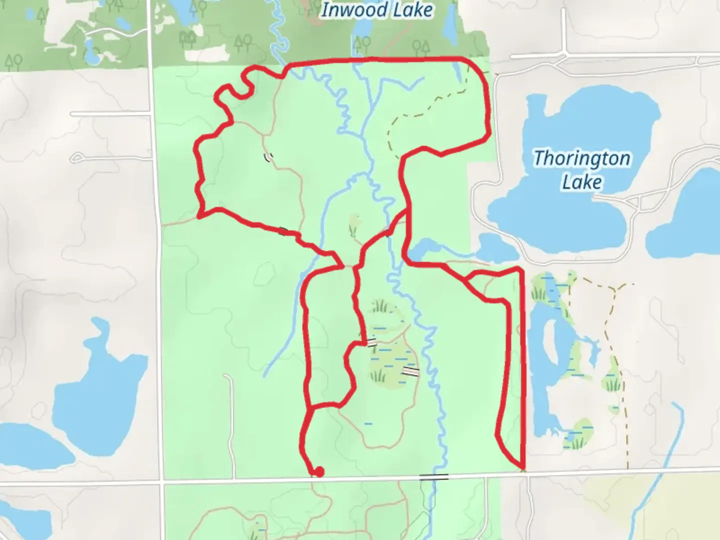 An image depicting the trail Inwood Rustic Trails Loop and its surrounding area.