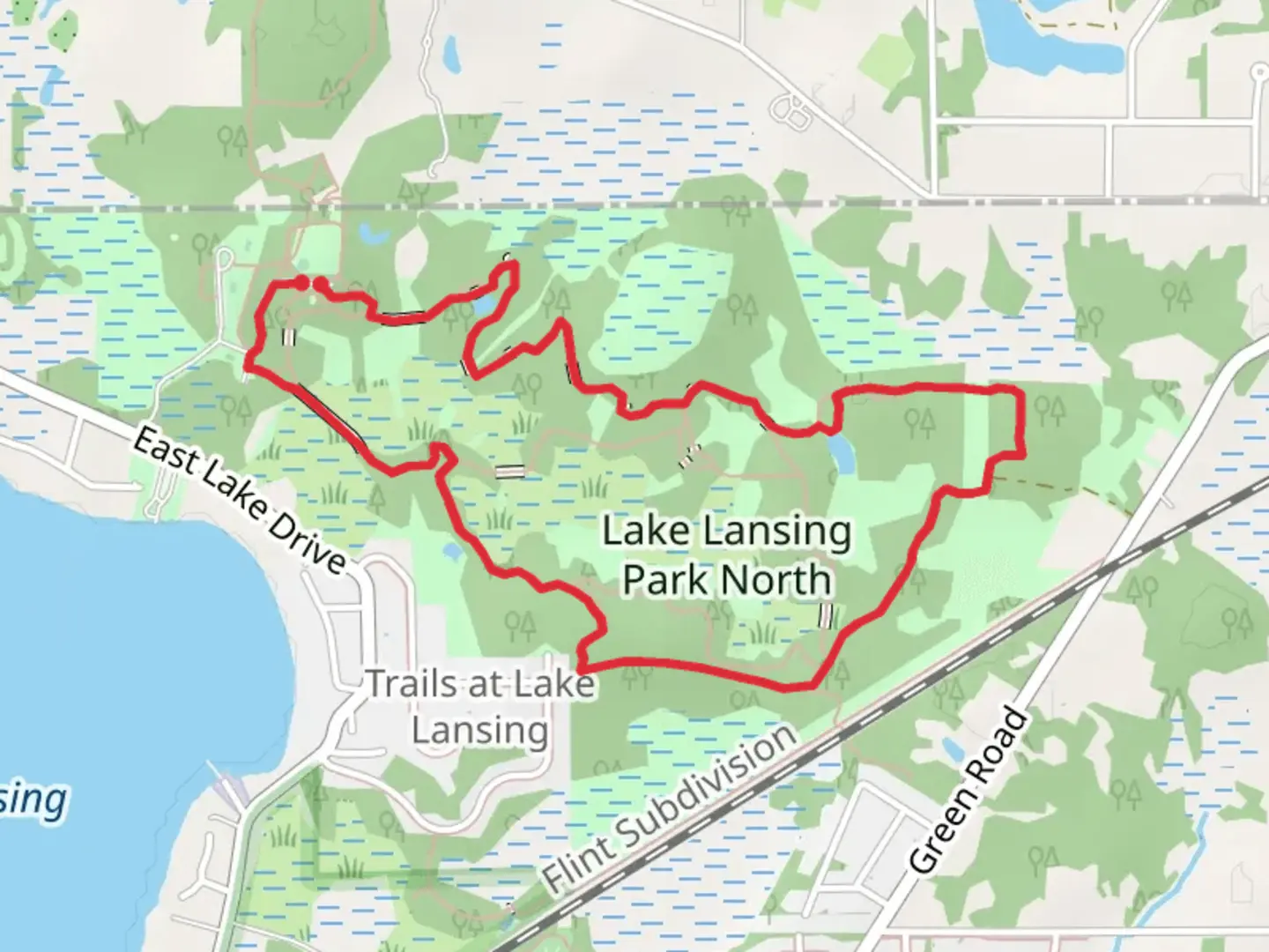 An image depicting the trail Lake Lansing North Blue Loop and its surrounding area.