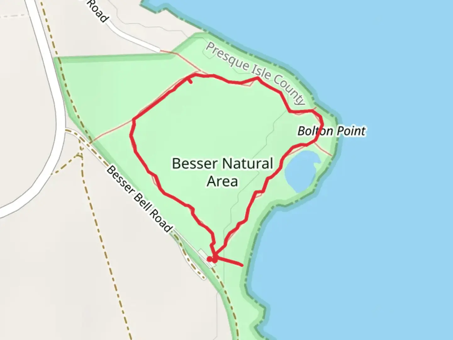 An image depicting the trail Besser Natural Area Loop and its surrounding area.