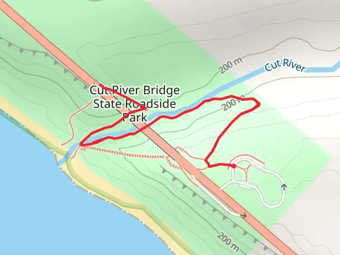 An image depicting the trail Cut River Bridge State Roadside Park and its surrounding area.