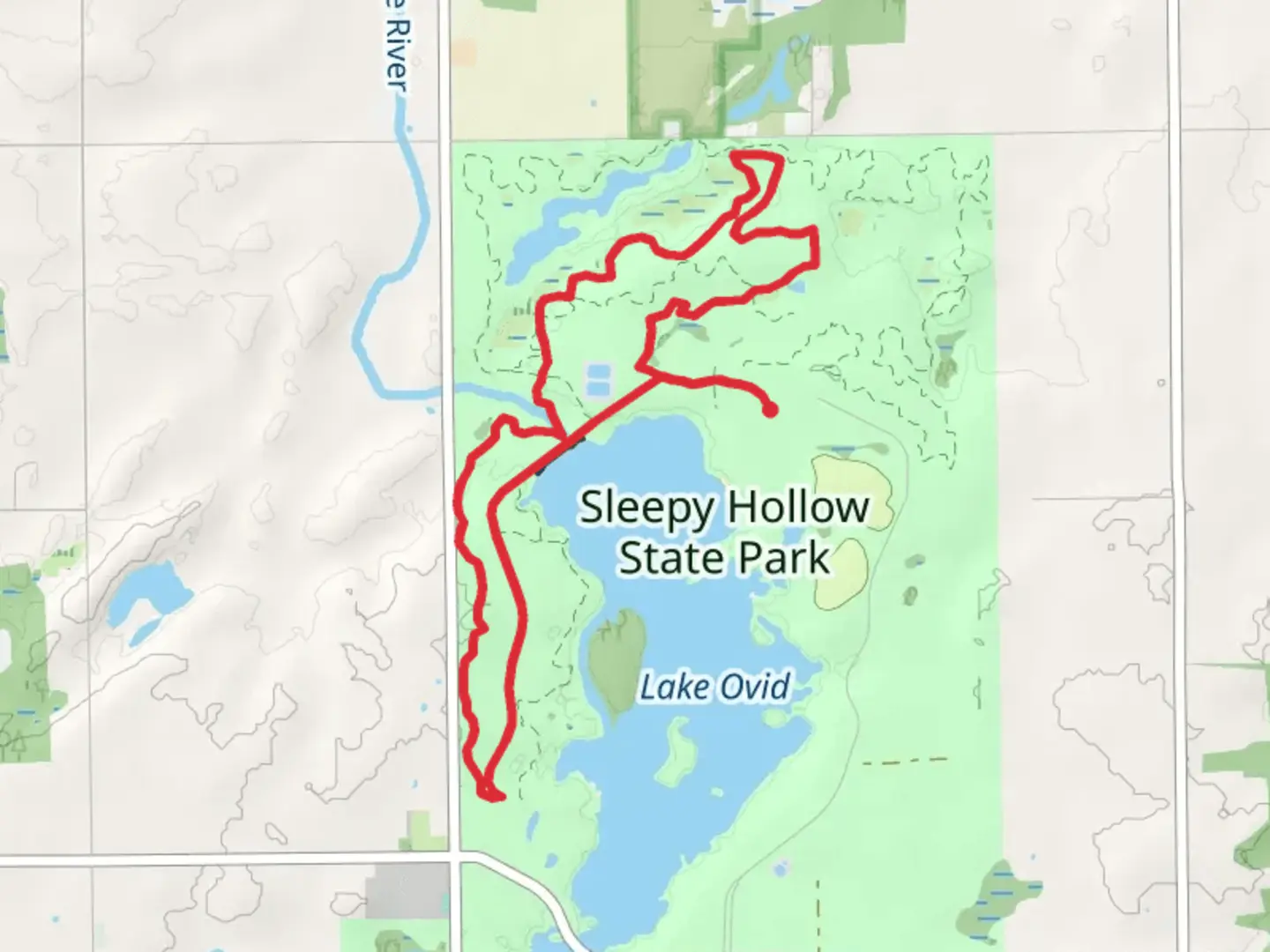 An image depicting the trail Little Maple River - Lake Ovid Loop and its surrounding area.