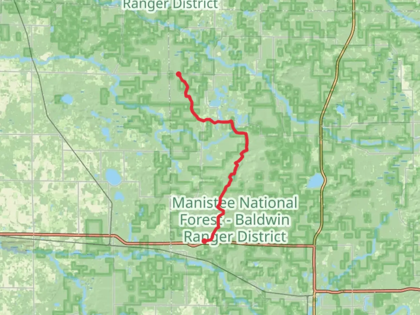 An image depicting the trail North Country National Scenic Trail from West 8 Mile Road and its surrounding area.